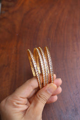 Set of 4 delicate white stone bangles