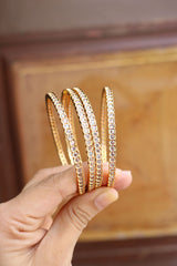 Set of 4 delicate white stone bangles