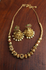 Ruby Green Square Maala and Sunflower Jhumkas