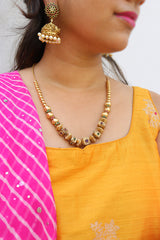 Ruby Green Square Maala and Sunflower Jhumkas